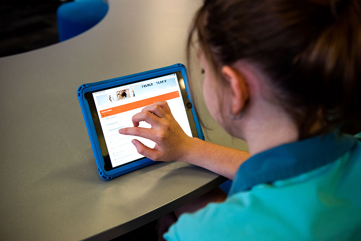 Student using Schoolbox on an iPad.